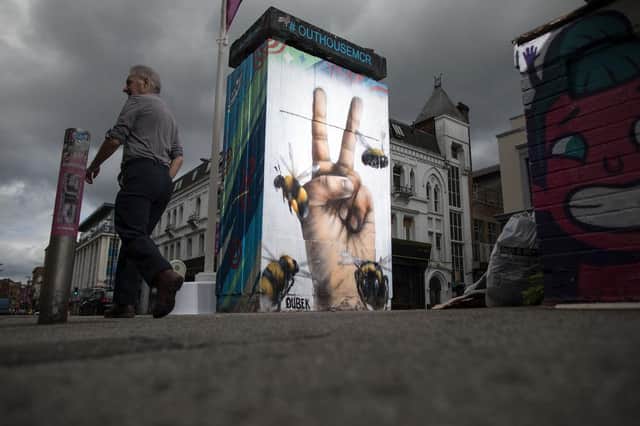 A mural of the worker bee, by artist Russell Meeham, also know as Qubek, adorns the side of a building in Manchester's northern quarter (Getty Images)