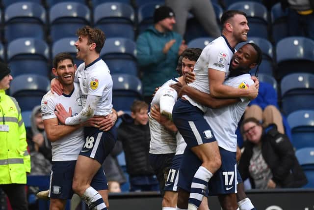Preston North End's Ched Evans is congratulated on scoring his team’s second goal