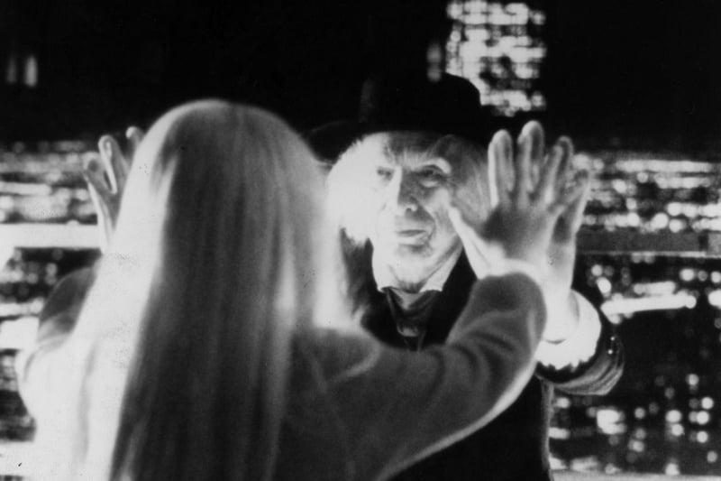 Reverend Henry Kane, the malevolent preacher in the supernatural horror film Poltergeist II. He had a spine-tingling presence in the movie, and you thought so too. The picture also shows Heather O'Rourke as Carol Anne in the film