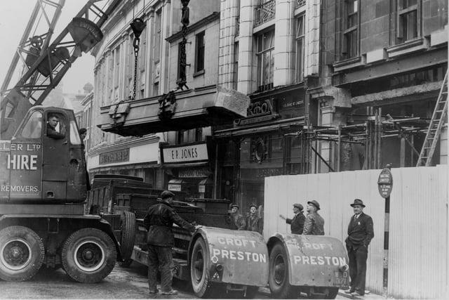 Not a hard hat in sight as the largest piece of stone to come out of the Thorne Croft Quarries, Longridge, was taken down from the front of the Lancashire Evening Post building in Fishergate, Preston, during the course of alterations in 1958. It was believed to be the biggest single block of stone in any local building