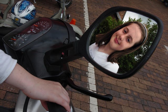 10 year old Pheobe Akroyd of Walton le Dale on her dads 1992 Vespa at the Vintage Motor Scooter Club rally at the South Ribble Motor Museum