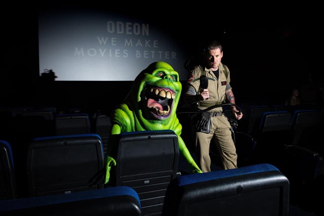 Mike Bell sneaks up on Slimer as Preston City Ghostbusters surprised film goers with a surprise visit to Oden Cinema in Preston. Photo: Kelvin Lister-Stuttard