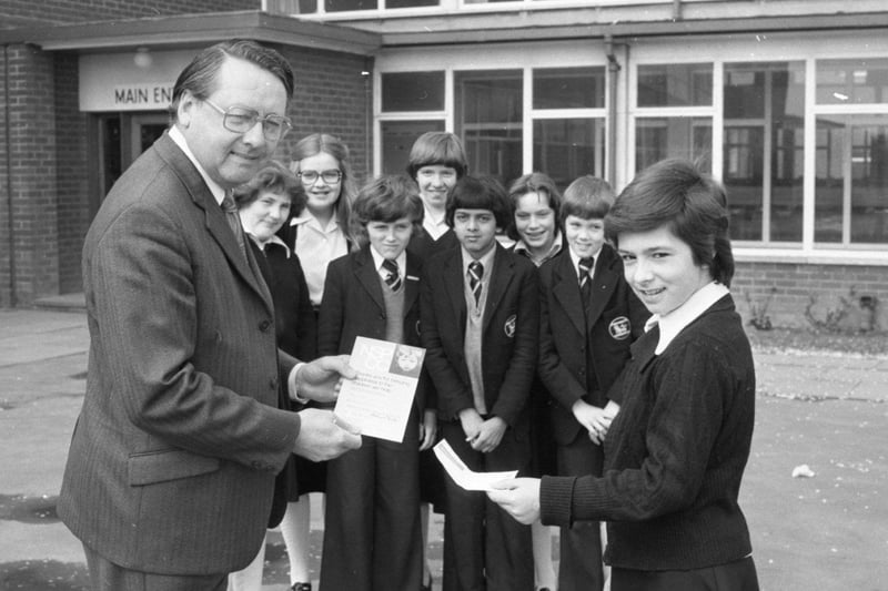 Silence really was golden for children at Ashton High School in Preston. Almost 200 youngsters sat in absolute silence for more than an hour - and raised £100 for the NSPCC. Presenting the cheque to NSPCC regional organiser Mr Roland Foot, on behalf of the pupils is Beverley Ashcroft, watched by Christine Fox, Ian Small, Shuresh Patel, Ian Williams, Gaynor Whincup, Caroline Newton and Janice Kent, who represented their classes