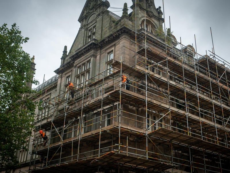 Workmen erecting scaffolding on the former Post Office building in Preston City Centre