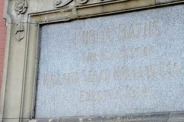 The plaque bearing the name of the man who bequeathed the baths to Kirkham might be fading - but residents' memories of that fact are not
