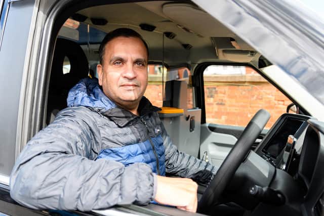 Preston taxi driver Mahammed Anub in his cab at Preston Train Station claims that youths are throwing stones had his taxi whilst he is working. Photo: Kelvin Stuttard