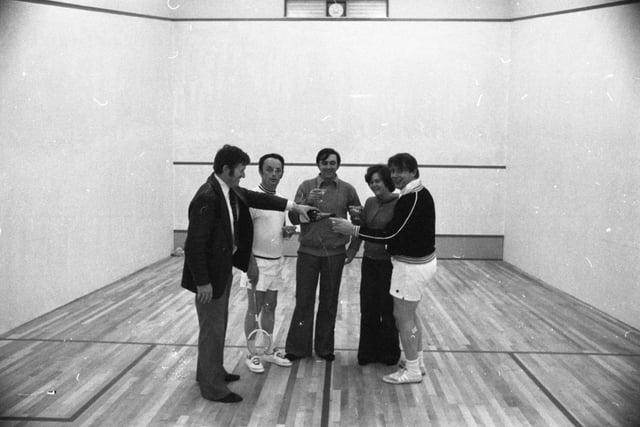 Squash club committee members Martin Mears, Ken Fleuriot, Ken Moore, Jean Roberts and Roger Wilcock toast the opening of new squash courts at Preston Grasshoppers in Fulwood