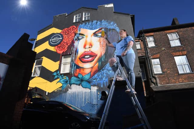 Photo Neil Cross; Olivia Hayes with the new mural at The Station, Preston
