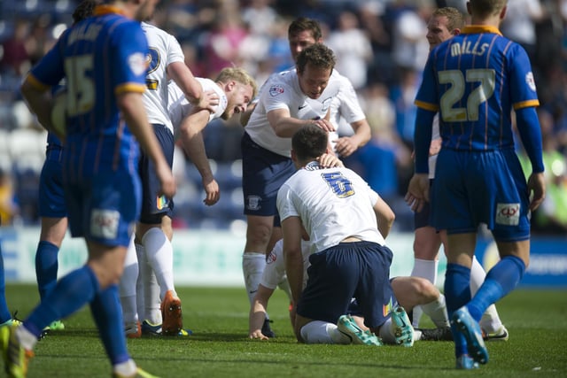 Preston North End's Bailey Wright (#6) celebrates scoring his sides second goal with team-mate Kevin Davies.