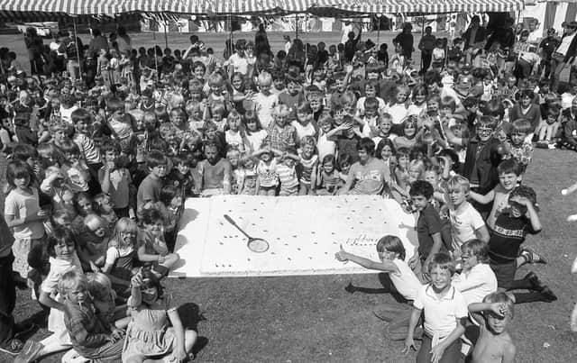 Gallons of milk, scores of dozens of eggs and tons of butter went into providing youngsters at a Lancashire playscheme with a special birthday treat. No fewer than 18 chefs spent a week preparing this giant 8ft long cake to help children at Leyland celebrate their playscheme's 10th birthday
