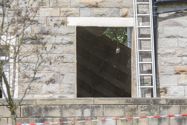 Damage could be seen inside a house after emergency services were called to reports a house had collapsed following an explosion in Sefton Terrace shortly after midday on Monday