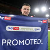 Paul Heckingbottom poses for a photo after winning promotion to the Premier League