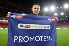 Paul Heckingbottom poses for a photo after winning promotion to the Premier League