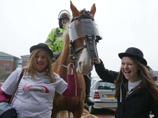 Bowler-hatted PNE fans outside Bolton's ground in 2016