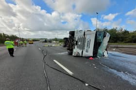 The overturned lorry that has caused the closure of the M6 near Preston on Sunday
