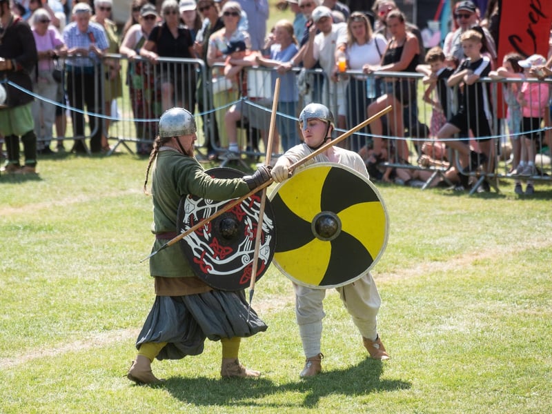 Heysham Viking Festival 2026 - two Vikings sparring with spears and shields.