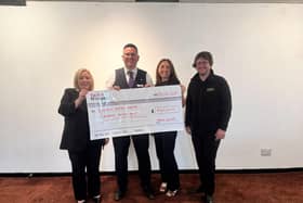 Taylor Wimpey representative with Blackburn Empire Theatre staff.