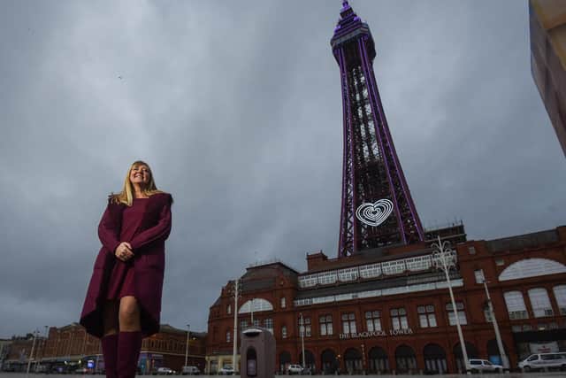 Lisa McNeill outside Blackpool Tower, which is lit purple for World Aspergillosis Day on Feb 01.