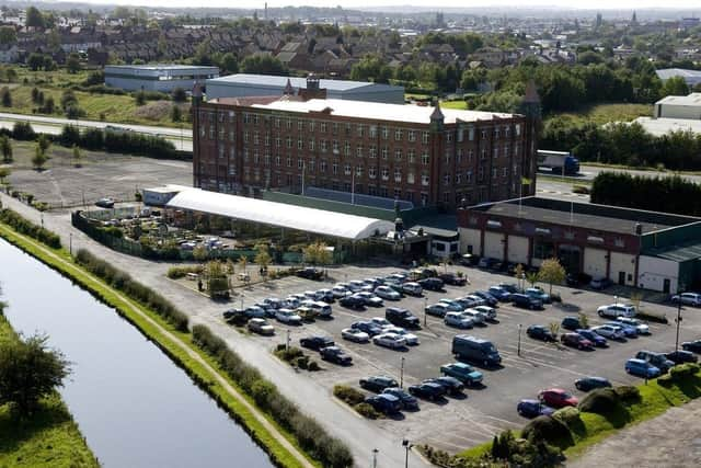 The landmark Botany Bay mill building, alongside the Leeds/Liverpool Canal, pictured before its closure in February 2019