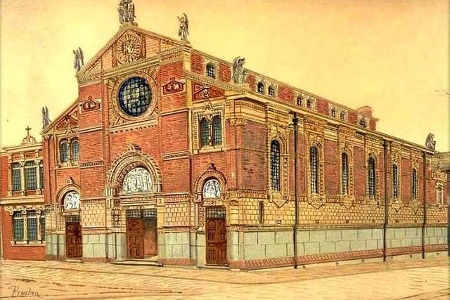 This is St Wilfred's Church, as composed by Edwin Beattie, a famed photographer and painter from Preston. The Roman Catholic church, on Chapel Street, was built to replace a smaller church on the site. It was expanded and remodelled in 1878, and its exterior was re-cased 10 years later. It is built in brick with terracotta cladding and dressings, and has a slate roof; and is in the style of an Italian basilica. It consists of a nave, aisles, a baptistry, chapels, and an apse at the east end. Inside are large Corinthian columns. St Wilfred's Church is a Grade II* listing building