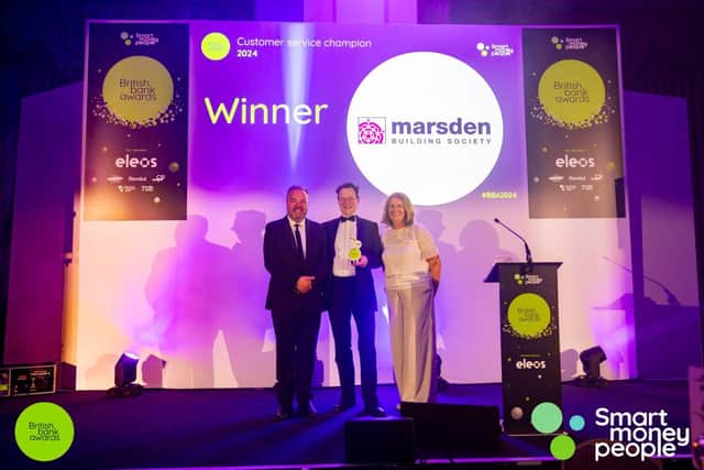 Marsden’s Phil Relf (centre) collecting the Customer Service Champion award