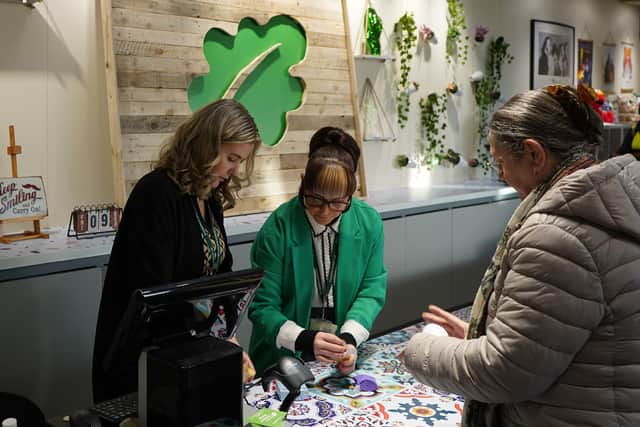 A customer making a purchase at the new St John's Hospice sustainable superstore.