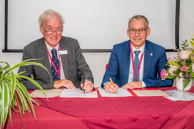 Signing of a Memorandum of Understanding by Professor Andy Schofield, Vice-Chancellor of Lancaster University, and Nigel Law, Chairman of Trinity Hospice