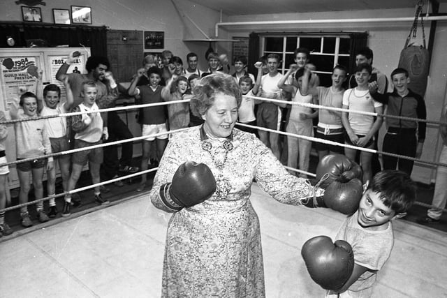 The Mayor of Preston, Nancy Taylor, hits 12-year-old John Hudson, of Leyland, with her famous left hook at the opening of Preston and Fulwood Amateur Boxing Club's new headquarters at the Catherine Beckett Rooms, Deepdale
