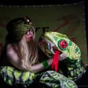 Pictured is Ruth Collinge as Eve the Snake Charmer