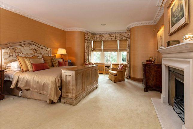 This grand bedroom boasts its own fireplace, bay windows, an en suite and space for a massive bed.