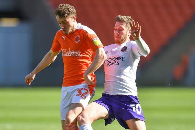 Josh Vela (right) in action for Shrewsbury against Blackpool in 2020/21