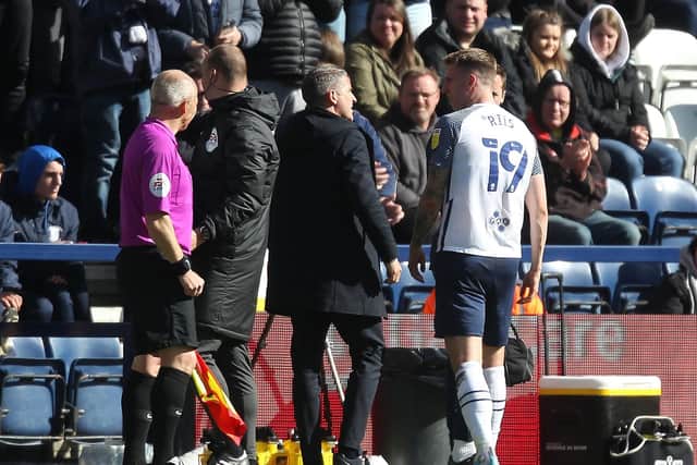 Preston North End manager Ryan Lowe checks on Emil Riis as he comes off injured against Queens Park Rangers at Deepdale