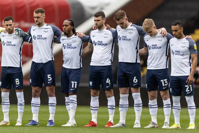 Preston North End players observe a minute’s silence before the match at Oakwell in remembrance of PNE and Barnsley fans who are no longer with us