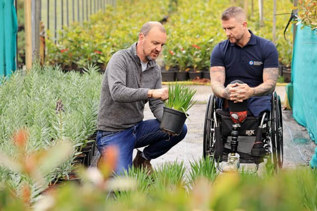 A Chelsea  garden is months or even years in the making - here John (left) shows Lancastrian Paralympian and RAF veteran Stuart Robinson some of the plants which were grown at Bannister Hall Nursery at Walton le Dale for the garden. Stuart will be a VIP visitor to the garden at Chelsea.