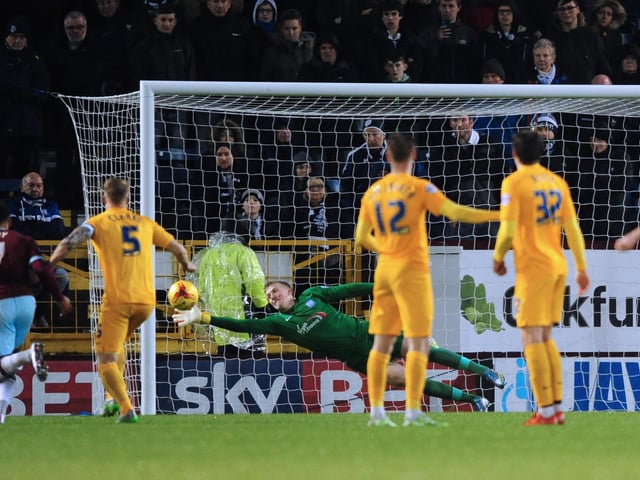 Preston North End's Jordan Pickford dives to his right to keep out a free kick taken by Burnley’s Joey Barton