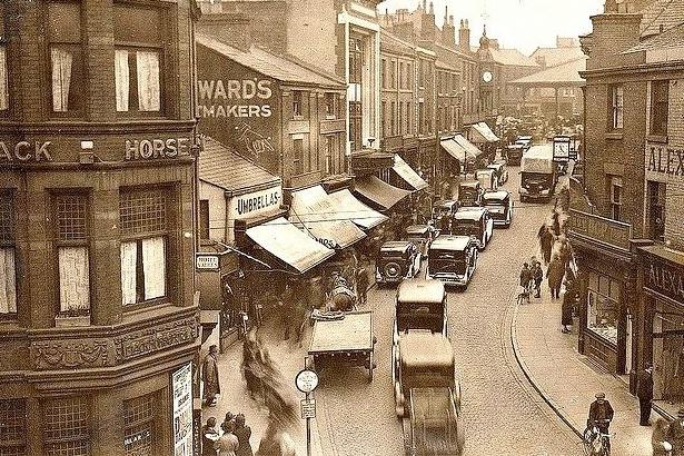 In 1935, when this image was taken, you can see that cars were free to drive up and down Orchard Street, and park. There was a good mix of shops which attracted plenty of shoppers