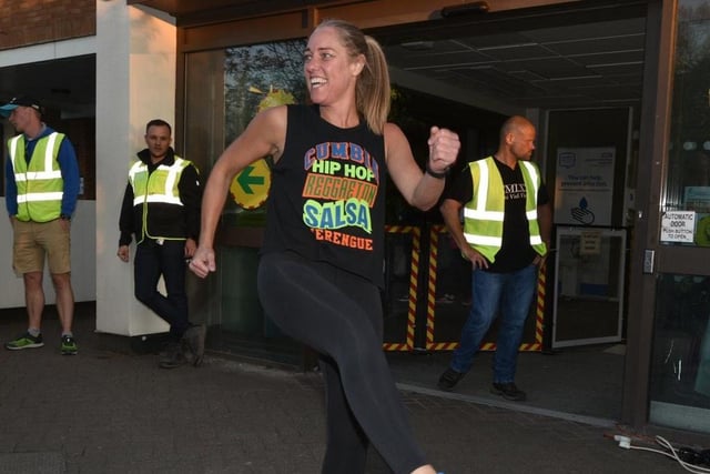 Jamie-Lee Kirby puts walkers through a Zumba warm up