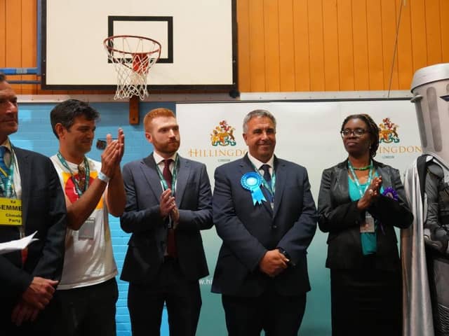 UXBRIDGE, ENGLAND - JULY 21: Conservative Party candidate, Steve Tuckwell (C), celebrates winning the Uxbridge and South Ruislip by-election as Labour Party candidate Danny Beales (3rd L) looks on July 21, 2023 in Uxbridge, England. The by-election was called when former Prime Minister Boris Johnson resigned as the MP ahead of the Privileges Committee finding he had misled Parliament over Partygate. (Photo by Carl Court/Getty Images)