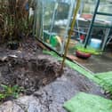 Plants and shrubs had stood where the hole appeared - and have now vanished from sight