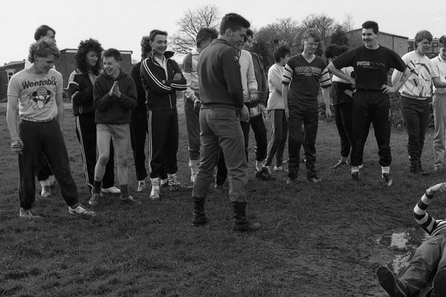 Staff from Morrisons in the Guild Hall Arcade take instruction from a soldier before tackling the army assault course at Fulwood Barracks in aid of the National Children's Home.