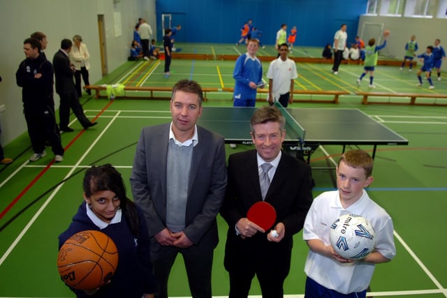 Preston North End manager Darren Ferguson with headteacher Tony Perry, left, Somiya Ahmed, 12 and, right, Dermot Getherings, 15, at the opening of Christ the King High School's new Sports Hall