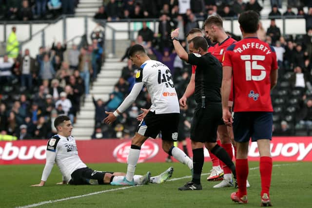 Preston North End defender Liam Lindsay is shown a red card by referee Geoff Eltringham for a foul on Derby County's Tom Lawrence