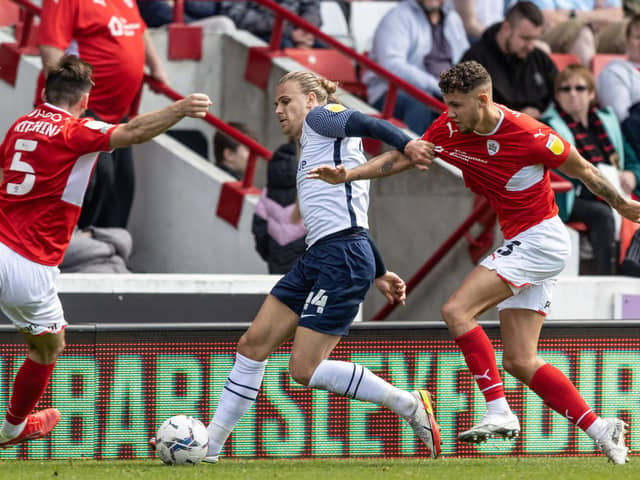 Preston North End wing-back Brad Potts competing with Barnsley's Liam Kitching and Matty Wolfe