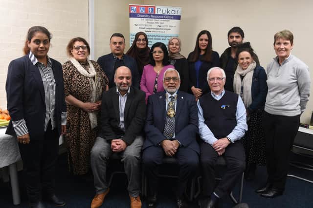 Mayor of Preston Coun Javed Iqbal pictured with trustees, staff and volunteers from the Pukar Disability Centre at the Centre's recent celebration afternoon  Photo: Neil Cross