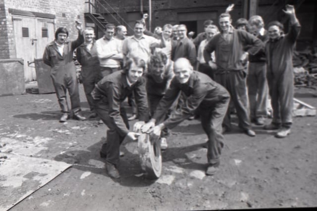 Foundary workers Joe Carter, George Eccleston and Michael Cawood roll out one of the final castings as Preston's last iron foundary - John Booths -  closes its doors on Derby Street
