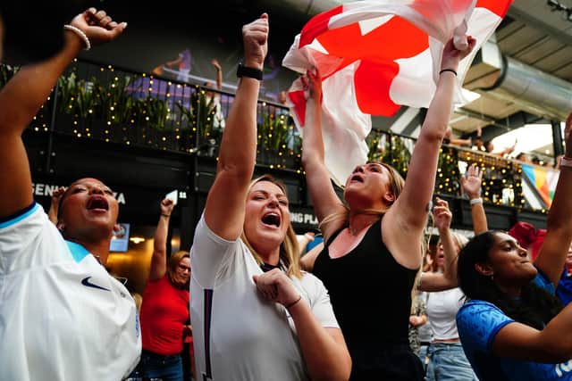 England fans celebrate following a screening of the FIFA Women's World Cup 2023 semi-final at BOXPARK Wembley, London (Photo credit: Victoria Jones/PA Wire)