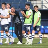 Preston North End manager Ryan Lowe celebrates at the end of the match with Jordan Storey after a clean sheet and win at Luton Town.