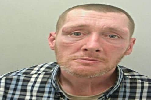 John McKay has been jailed for robbing a pensioner who suffers from Parkinson's disease (Credit: Lancashire Police)