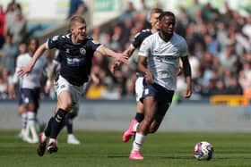 Preston North End's Josh Onomah and Millwall's George Saville battle for the ball