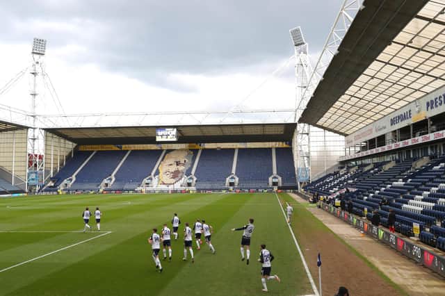 PRESTON, ENGLAND - APRIL 10: General view inside the stadium as the Preston North End squad run out for the start of the match during the Sky Bet Championship match between Preston North End and Brentford at Deepdale on April 10, 2021 in Preston, England. Sporting stadiums around the UK remain under strict restrictions due to the Coronavirus Pandemic as Government social distancing laws prohibit fans inside venues resulting in games being played behind closed doors.  (Photo by Alex Livesey/Getty Images)